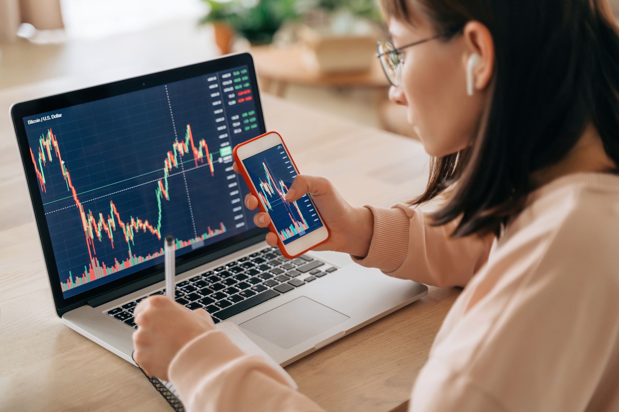 Young business woman trader investor working from home